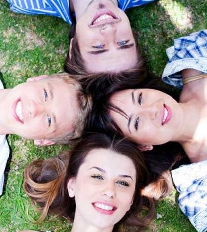 four loving and true friends with heads joined to express soulmates