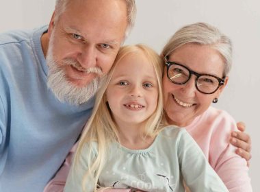 Aged grandparents with a grandkid between them