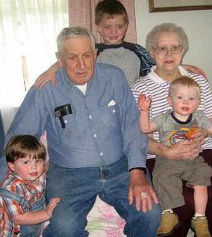 Grandparents sitting with their grandchildren