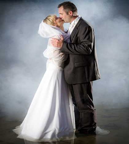 bride and groom kissing expressing romantic kind of love