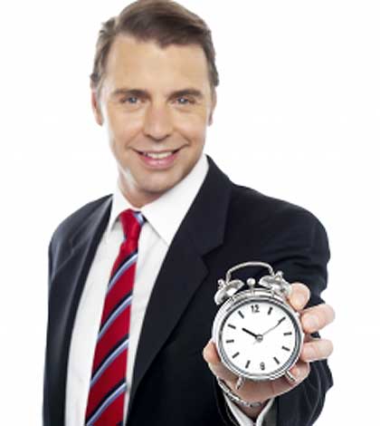 the father standing with a time clock in hand