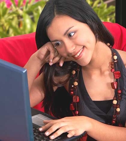 A girl chatting online social networking friendship on laptop