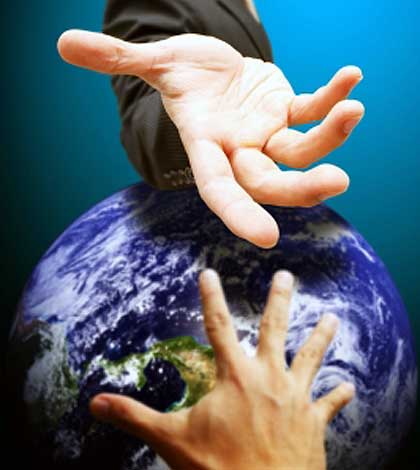 One hand helping others by extending over a globe