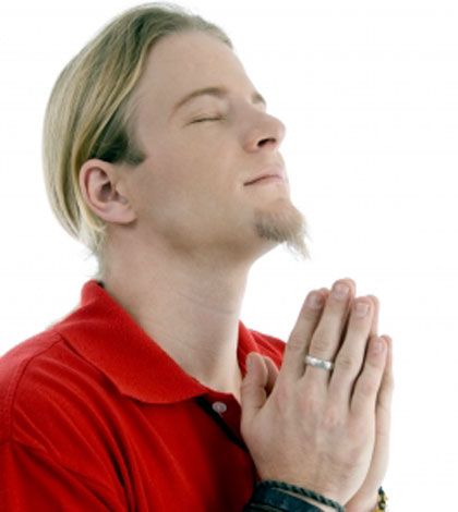 Man holding hands and remembering the dead