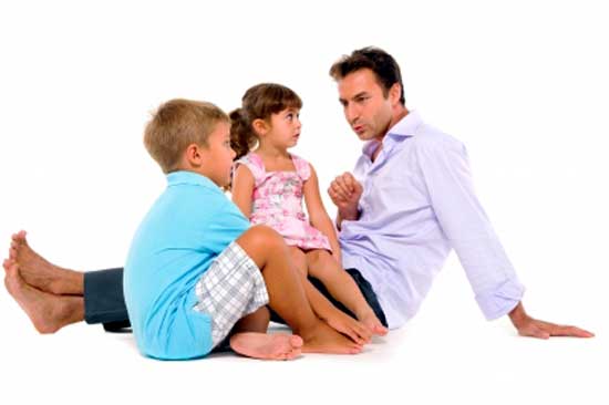 Children sitting with dad on Fathers Day