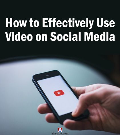 A person's hand scrolling mobile screen for video on social media