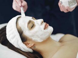 Woman getting face mask on her face to treat her skin better