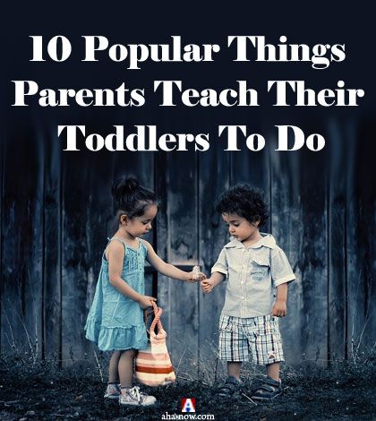 Two toddlers interacting as taught by parents