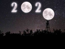 twenty twenty sign up in the dark sky with moons as number 0