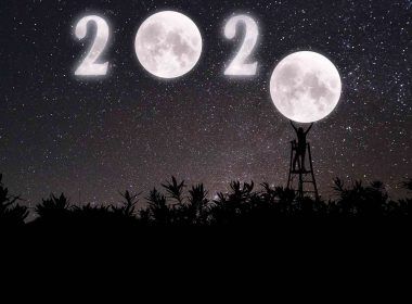 twenty twenty sign up in the dark sky with moons as number 0