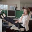 Woman resting in office getting things done by useful services