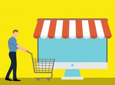 A clipart of a laptop as a business shop and man with a cart