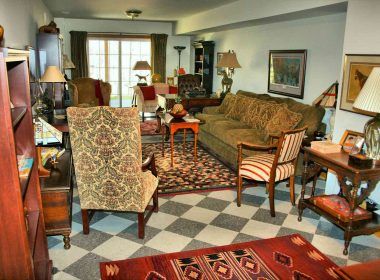 A family room decorated with rugs