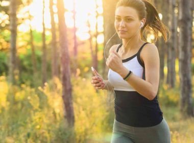 A woman jogging in the woods