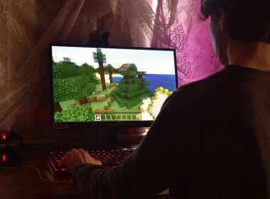 A boy playing MMORPGs on computer