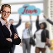 A people person executive woman with team in background