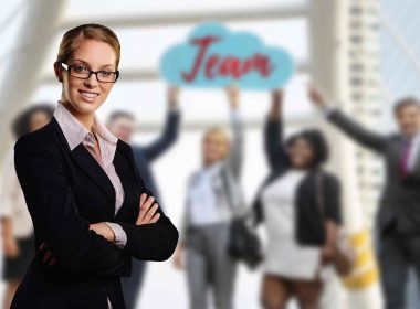 A people person executive woman with team in background