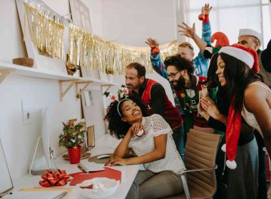 Coworkers celebrating farewell party in office
