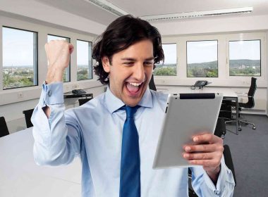 A contractor man happy with success inside an office