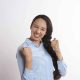 A woman excited and happy about achieving goals to change life