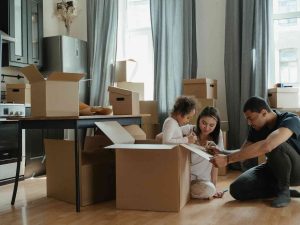 Husband, wife, and kid busy moving house