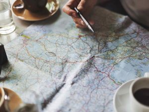 A paper map on table with water and coffee in emergency situation